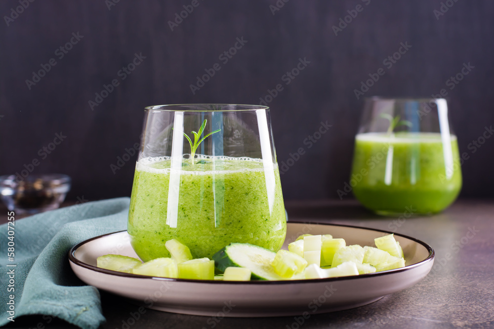 Fresh green cucumber and celery smoothie in glass for vegetarian diet - obrazy, fototapety, plakaty 