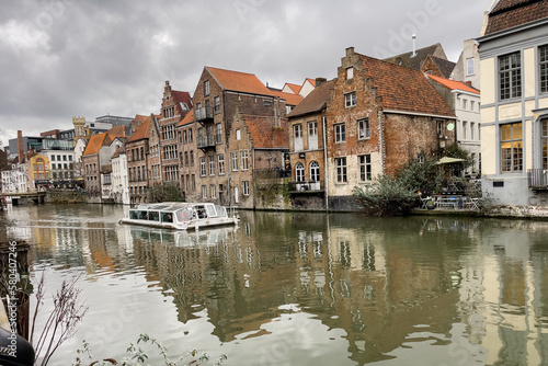 City tour boat sailing on the canal in Ghent, Belgium