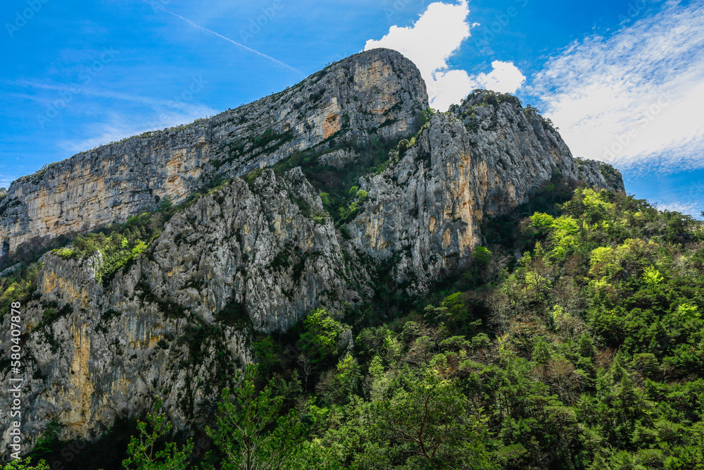 Big rough mountain cliffs with colorful blue skies in the background