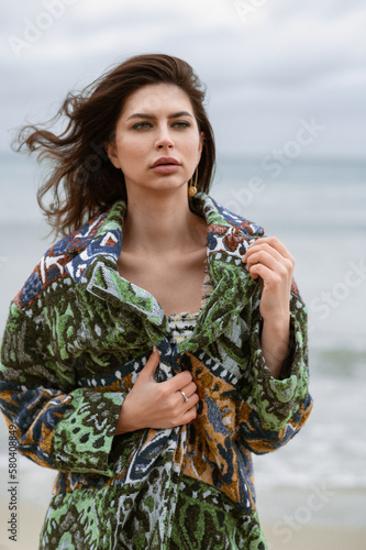 Fashion girl yachting in sea with sarong and blue sky sunlight. Young beautiful sexy woman in white dress relaxing at white luxury yacht. photo