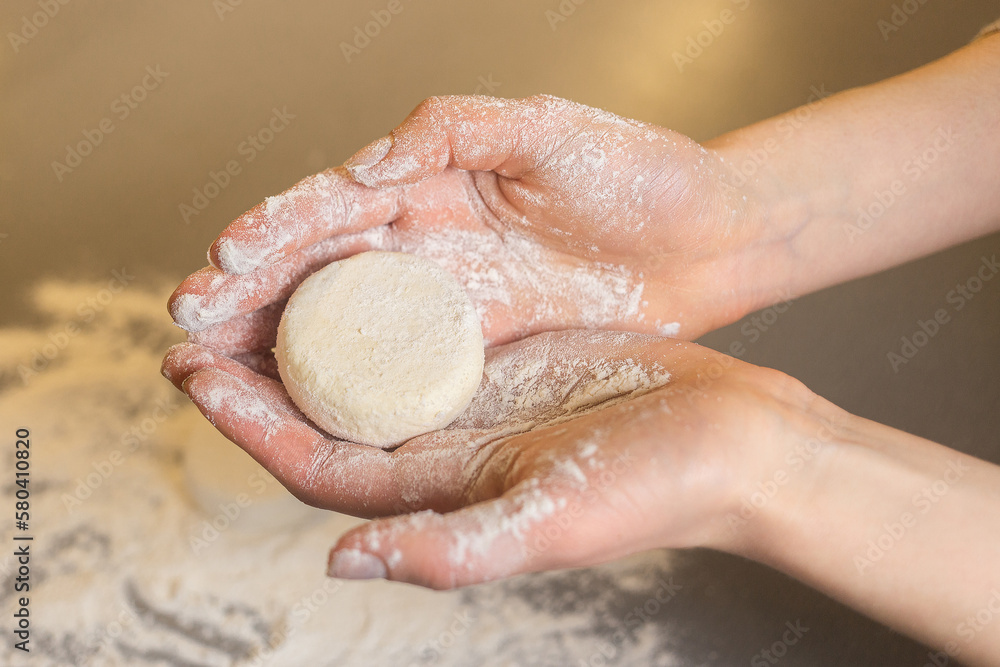 The girl is making cheese pancake in the kitchen The girl is making cheese pancake in the kitchen