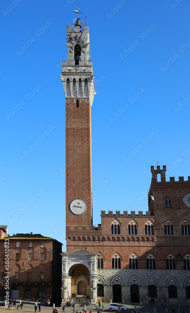 Siena Italy Tower called TORRE DEL MANGIA and the Cappella a marble tabernacle at the foot of the tower