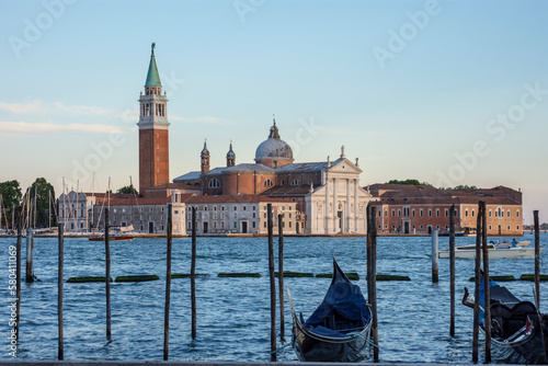 Piles and gondolas on the Venice canal  Church of San Giorgio Maggiore in the background 