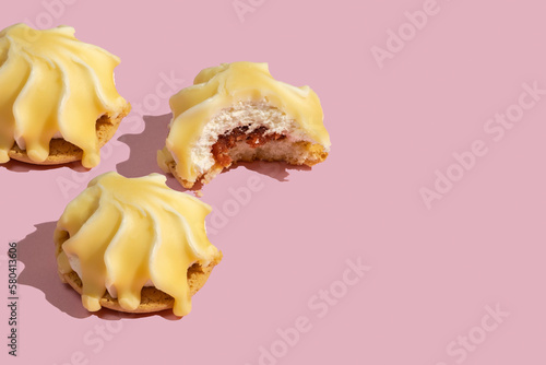 Cookies in the form of shell on pink background with copy space.