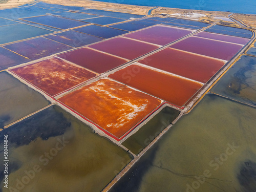 An aerial view of salt pans turning red due to salt bacteria