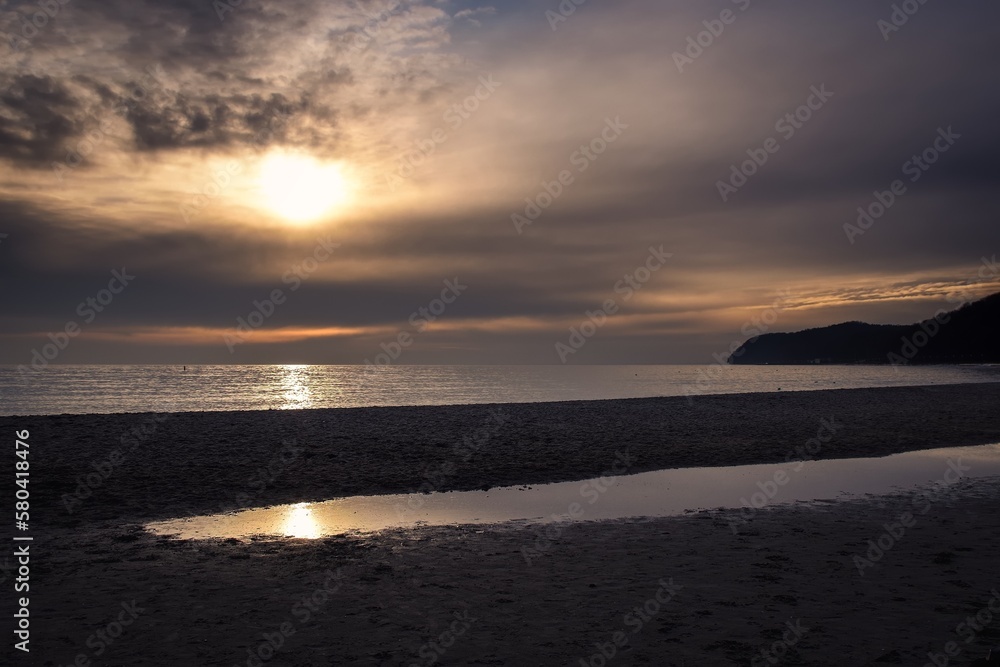 Morning sea landscape. Sunrise on the beach by the Polish Baltic sea.