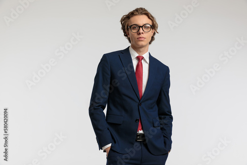 businessman posing with his hands in pockets