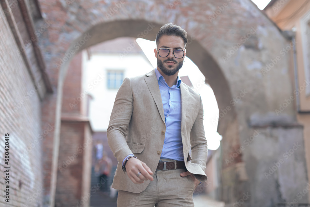businessman posing with hand in pocket and style businessman posing with hand in pocket and style