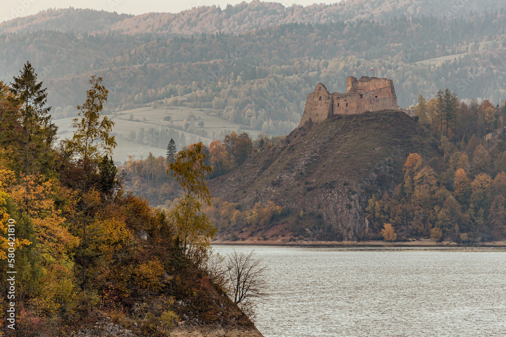 Wonderful Czorsztyn Castle by the lake at dusk in autumn. Pieniny Mountain. 