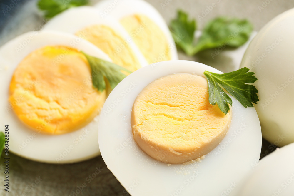 Delicious boiled eggs with parsley on plate, closeup