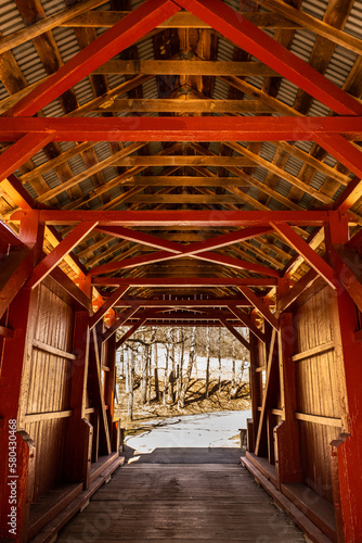 Red painted wood work inside the Ebenezer Covered Bridge in Mingo Creek County Park, outside of Pittsburgh, Pennsylvania.