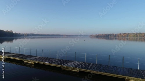Wallpaper Mural Aerial silhouette view of two anglers on a fishing boat it the middle of the lake. Two fishermen fishing at sunrise. Torontodigital.ca