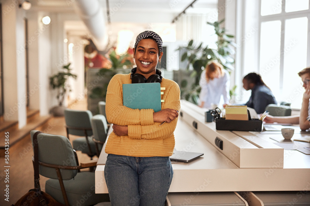 Smiling businesswoman at work in an office Smiling businesswoman at work in an office