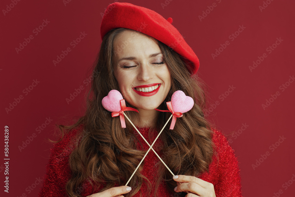 relaxed modern woman in red sweater and beret relaxed modern woman in red sweater and beret