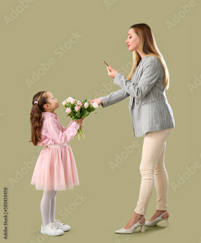 Mother taking picture of he...