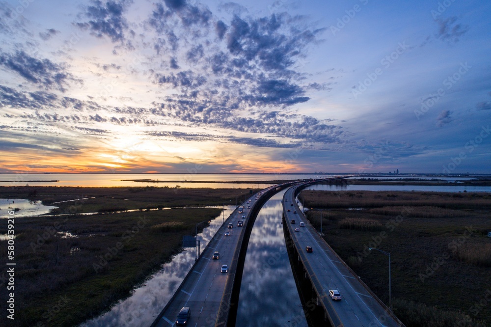 Aerial view of interstate 10 bridge on Mobile Bay at sunset