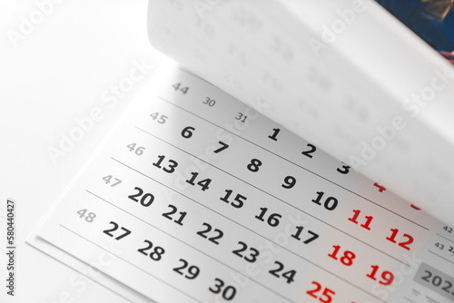 flipping through the pages of the flip calendar. 