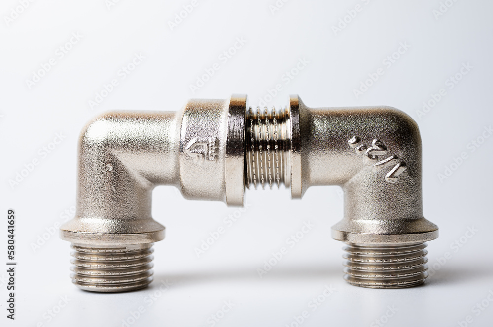 brass metal plugs, joints, adapters, hex key plugs for water isolated on light background close up plumbing connections and parts brass metal plugs, joints, adapters, hex key plugs for water isolated on light background close up plumbing connections and parts
