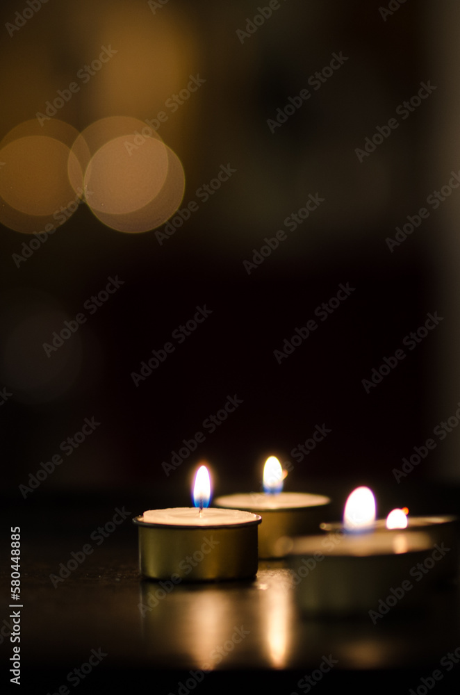 Small candles with dark background