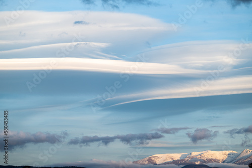 Panoramic view of large lenticular clouds over the snow-capped peaks of Sierra Nevada (Spain) © Miguel Ángel RM