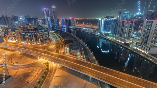 Skyscrapers at the Business Bay aerial night timelapse in Dubai, United Arab Emirates © neiezhmakov