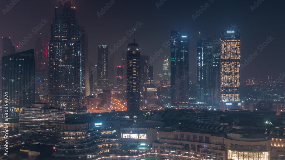 Aerial view of Dubai International Financial Centre DIFC district all night timelapse