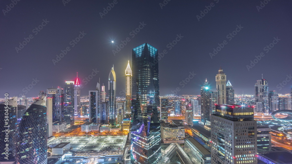Obraz premium Panorama of futuristic skyscrapers in financial district business center in Dubai all night timelapse