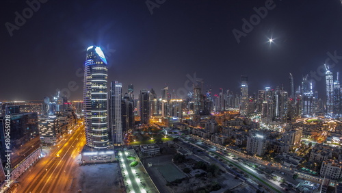 Dubai's business bay towers aerial all night timelapse. Rooftop view of some skyscrapers © neiezhmakov