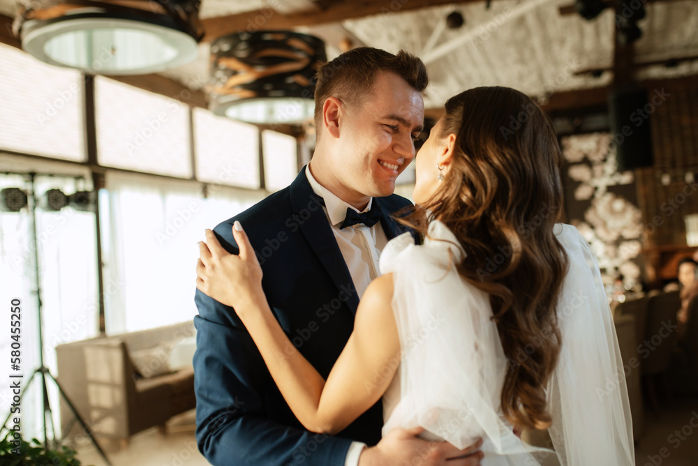 the first dance of the bride and groom inside a restaurant the first dance of the bride and groom inside a restaurant