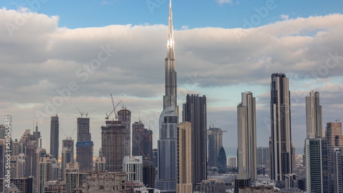 Panoramic skyline of Dubai with business bay and downtown district morning timelapse.