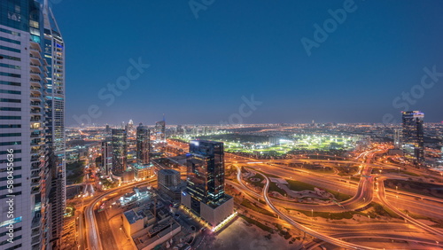 Fototapeta Naklejka Na Ścianę i Meble -  Aerial view of media city and al barsha heights district area day to night timelapse from Dubai marina.