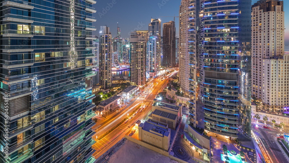 Panoramic view of the Dubai Marina and JBR area and the famous Ferris Wheel aerial day to night timelapse Panoramic view of the Dubai Marina and JBR area and the famous Ferris Wheel aerial day to night timelapse