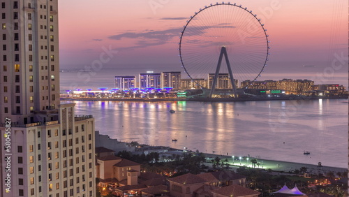 Photography Bluewaters island with modern architecture and ferris wheel aerial day to night timelapse
