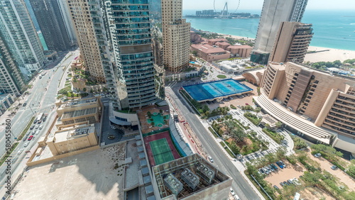 Panoramic view of the Dubai Marina and JBR area and the famous Ferris Wheel aerial timelapse