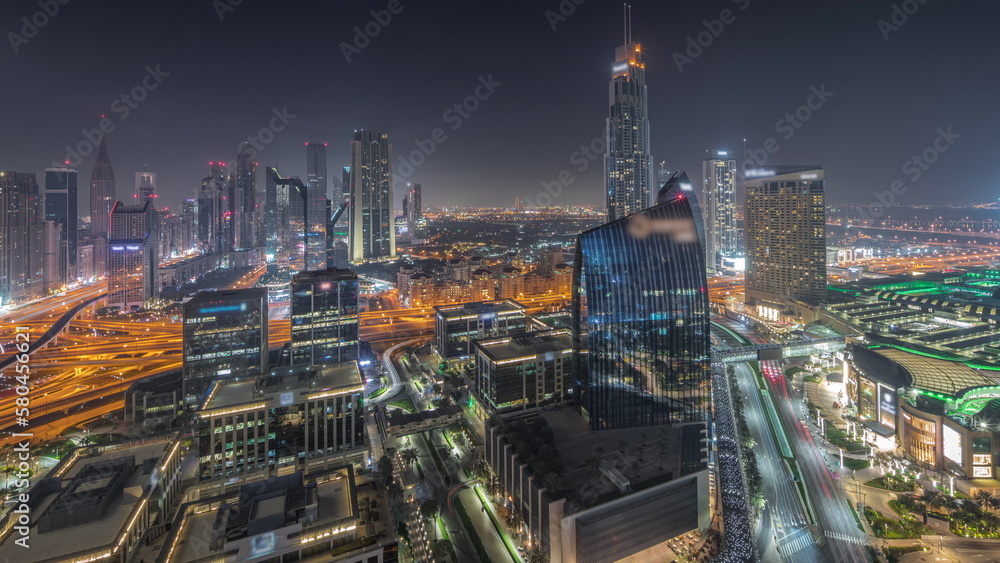 Futuristic Dubai Downtown and finansial district skyline aerial night timelapse.