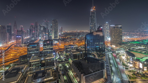 Futuristic Dubai Downtown and finansial district skyline aerial night timelapse.