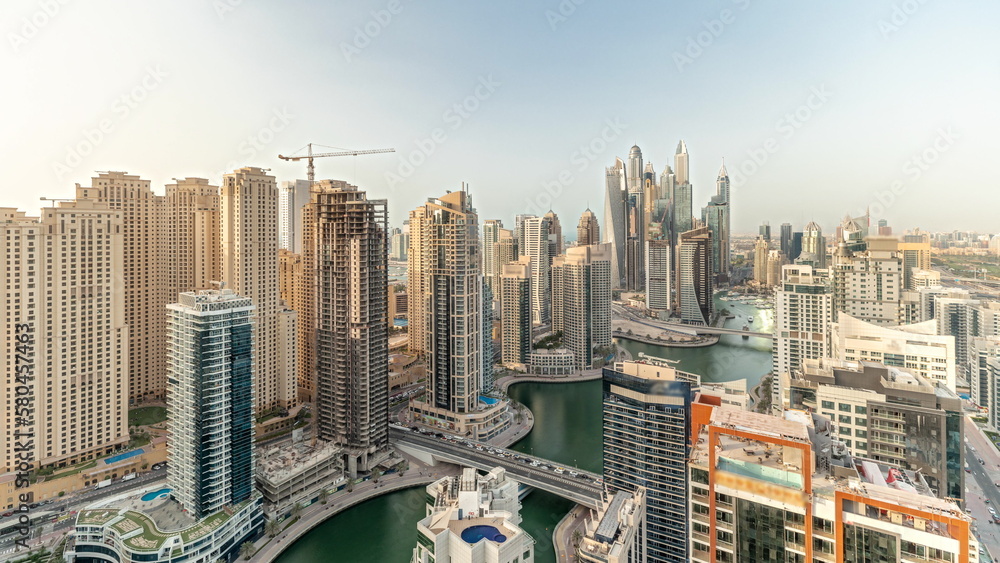 Fototapeta premium Panorama showing various skyscrapers in tallest recidential block in Dubai Marina aerial timelapse