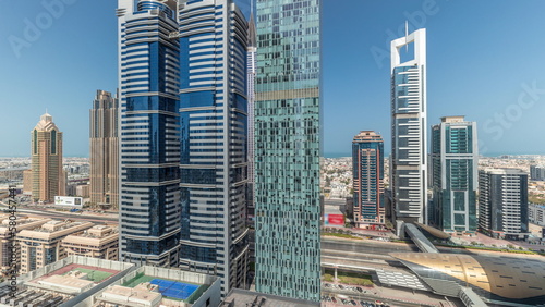 Photography Panorama showing aerial view of Dubai International Financial District with many skyscrapers timelapse