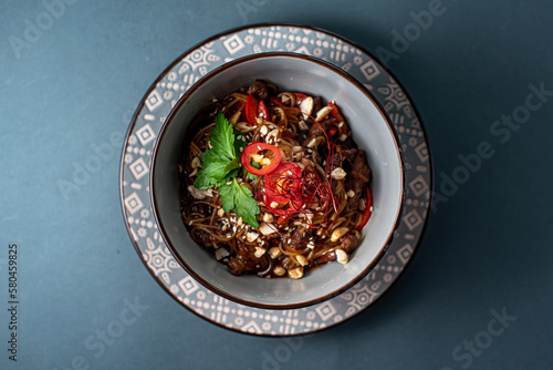 bowl red chili with noodles