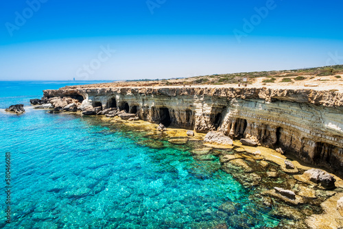 Sea caves near Ayia Napa in Cyprus. Natural rock formation famouse for cliff jumping into clear water. Dramatic coastline between Agia Napa and Cavo Greco National park