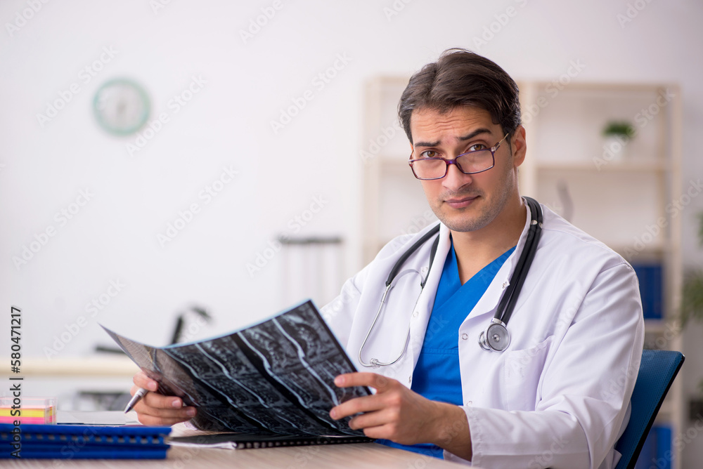 Young male doctor radiologist working in the clinic Young male doctor radiologist working in the clinic