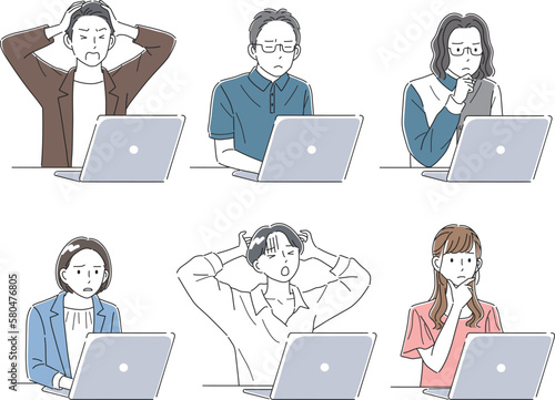 困った表情でノートパソコンを見ているビジネスパーソン