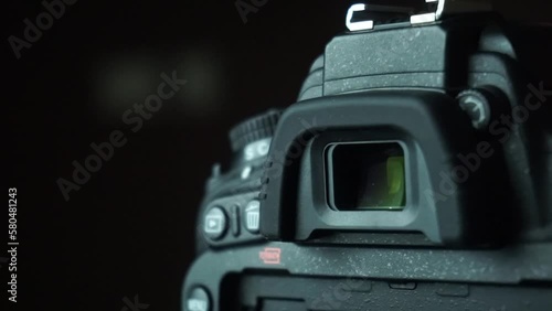 Closeup of DSLR camera viewfinder and camera buttons
