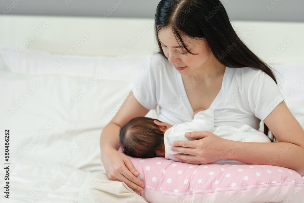 mother breastfeeding newborn baby on support pillow cushion mother breastfeeding newborn baby on support pillow cushion