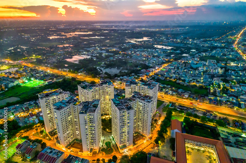 Obraz na plátně Ho Chi Minh City, Vietnam aerial view with residential area below showing the ur