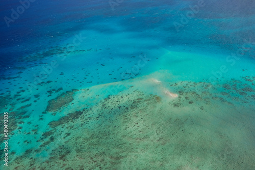 An aerial view of Vlasoff Cay, in the Great Barrier Reef: tropical white sand bar, coral reefs, clear turquoise waters — Coral Sea, Cairns; Far North Queensland, Australia
