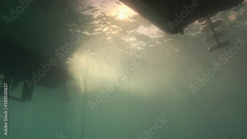 Underwater view on dive deck in sun. As you step onto dive deck and take in breathtaking view of underwater world, you know that you are in for an unforgettable experience. photo