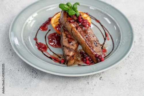 Tasty duck breast with orange and berries