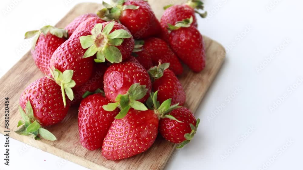 Ripe Red Strawberries in a bowl on table Ripe Red Strawberries in a bowl on table