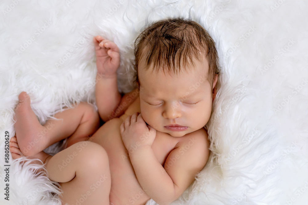 newborn baby girl sleeping on a green background in a soft crib, the birth of a baby, an infant in a newborn pose after childbirth newborn baby girl sleeping on a green background in a soft crib, the birth of a baby, an infant in a newborn pose after childbirth